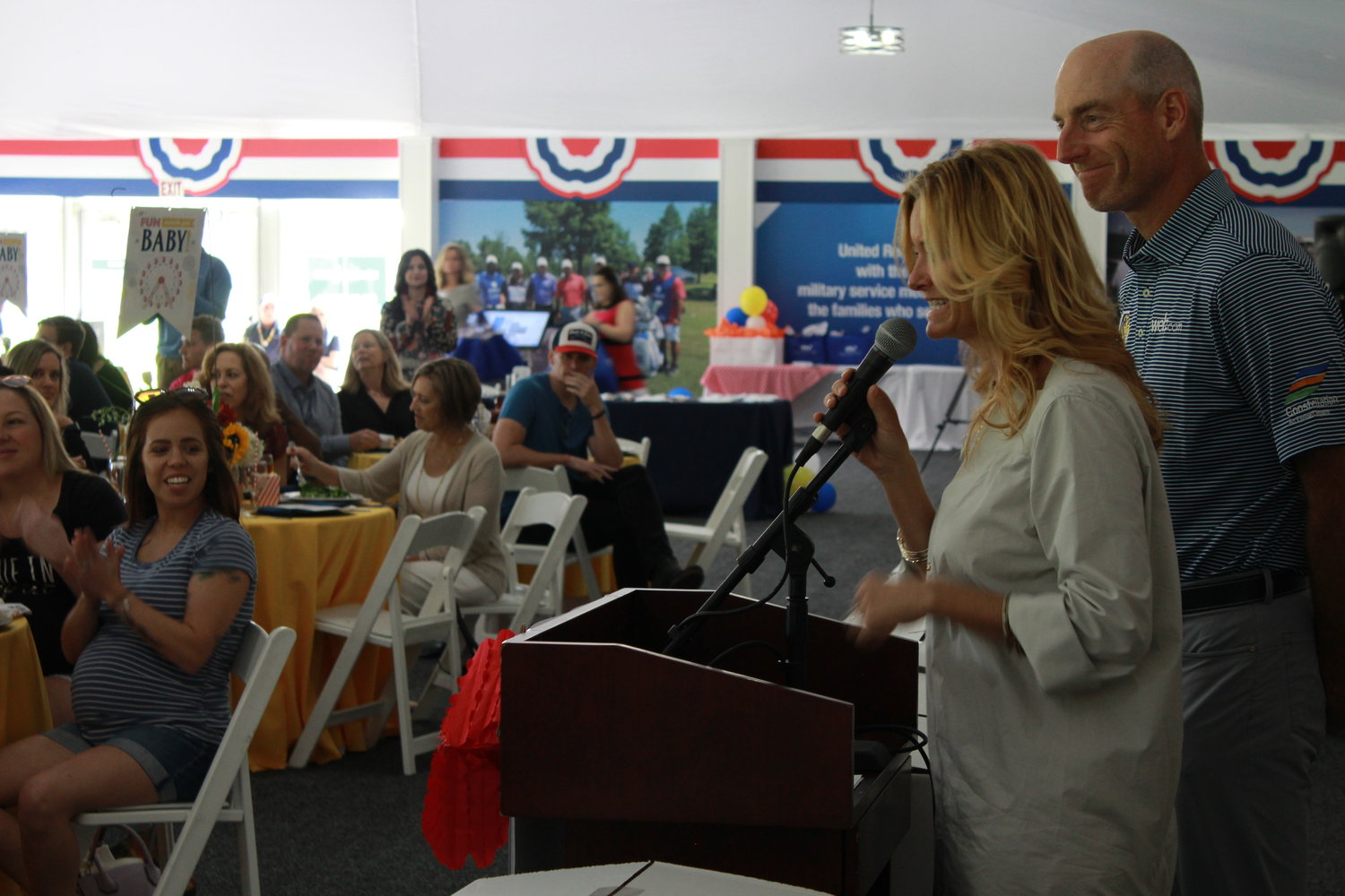 Tabitha and Jim Furyk address attendees of Operation Shower.